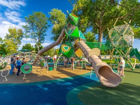 Families enjoying the inclusive playground at Berthoud Town Park