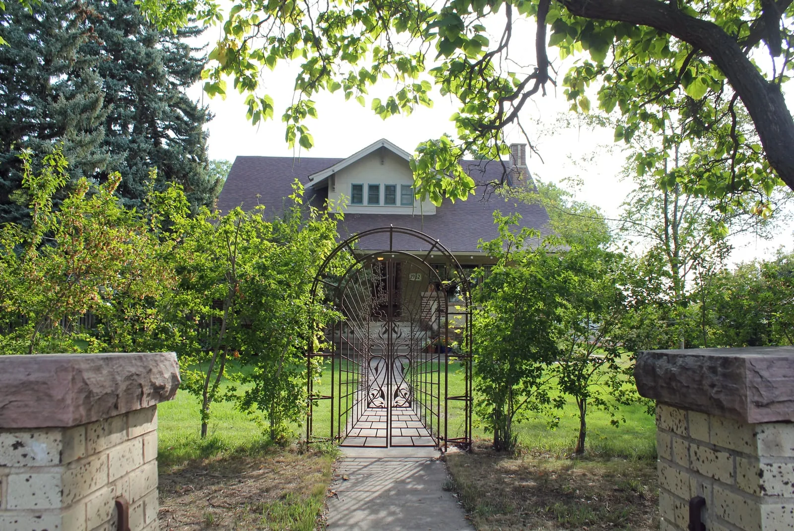 The gated walk to the Gustav and Annie Swanson farmhouse, a 1918 farmstead outside Berthoud