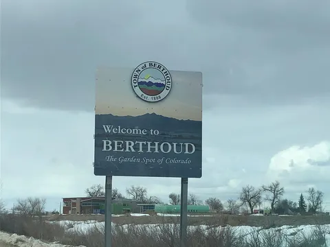 The Town of Berthoud welcome sign, 'The Garden Spot of Colorado', on a grey winter day